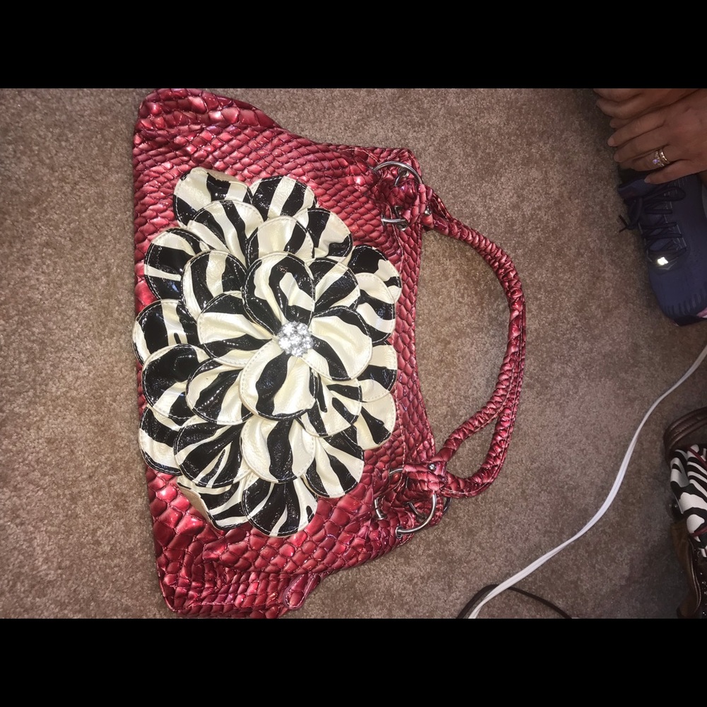 Red Purse with Zebra Patterned Flower on the Front